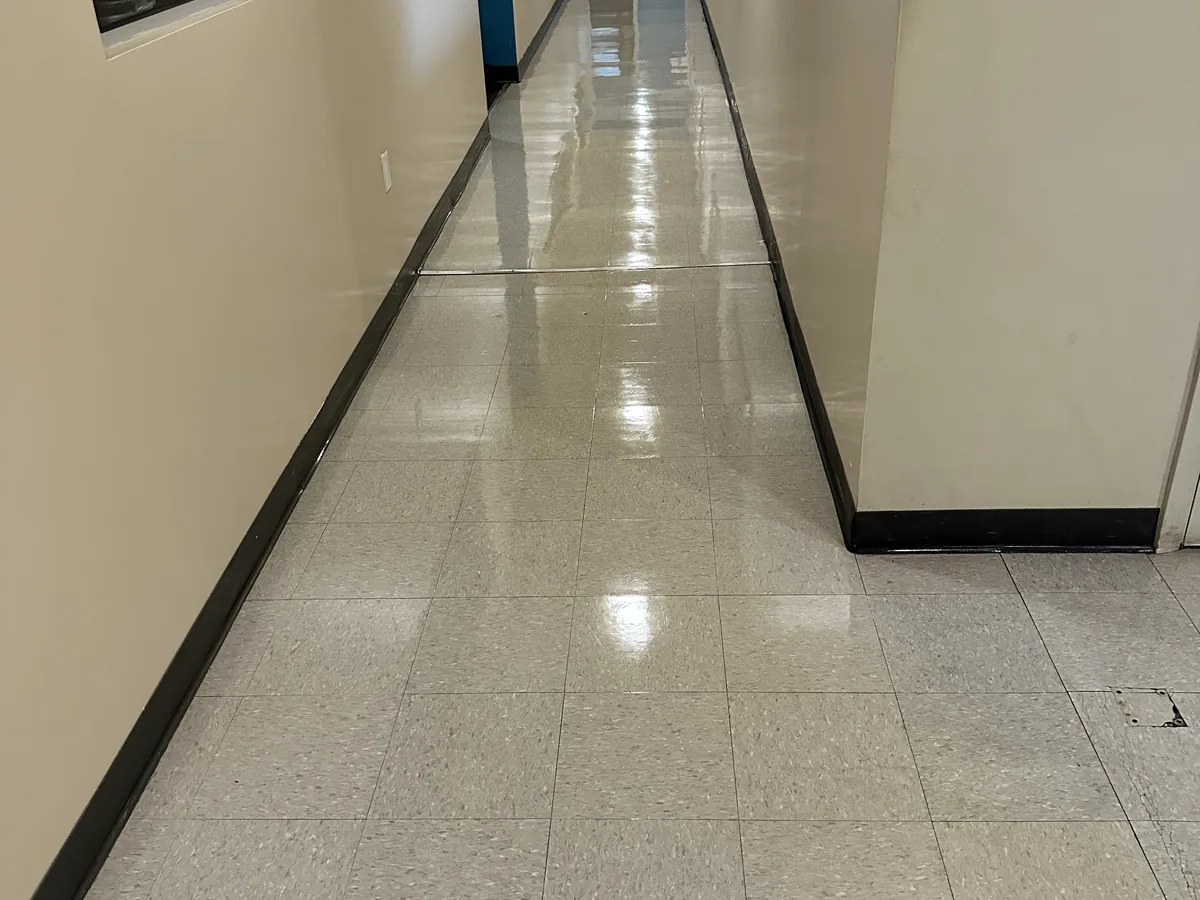 Waxed VCT corridor floor in a commercial building